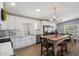 Modern kitchen with white cabinets, stainless steel appliances, and a butcher block island with seating at 427 S 80Th Way, Mesa, AZ 85208