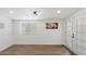 Bright and airy living space featuring a window, door, and neutral walls at 427 S 80Th Way, Mesa, AZ 85208