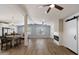 Spacious living room with brick accents, modern fireplace, wood-look floors, and an open floor plan at 427 S 80Th Way, Mesa, AZ 85208