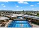 Aerial view showcasing well-maintained pickleball courts with mountain views in a vibrant community at 427 S 80Th Way, Mesa, AZ 85208