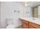 Well-lit bathroom with a spacious vanity and ceramic tile flooring at 4406 E Carter Dr, Phoenix, AZ 85042