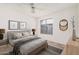 Cozy bedroom features a queen size bed, neutral colors, large window, and plush carpeting at 4406 E Carter Dr, Phoenix, AZ 85042