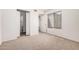 Bright bedroom featuring wall-to-wall carpet and a view of the hall at 4406 E Carter Dr, Phoenix, AZ 85042