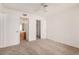 A bright bedroom featuring neutral carpeting and doorways leading to the bathroom and closet at 4406 E Carter Dr, Phoenix, AZ 85042