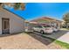 Carport featuring parking for two cars, a paved driveway, and a well-maintained home exterior at 4406 E Carter Dr, Phoenix, AZ 85042