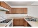 Classic kitchen showcasing wood cabinets, white countertops and essential appliances at 4406 E Carter Dr, Phoenix, AZ 85042