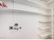 Storage and laundry room with lots of shelving, and utility hookups at 4406 E Carter Dr, Phoenix, AZ 85042