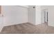 Living Room featuring neutral carpeting, an open doorway and an entry into an adjacent room at 4406 E Carter Dr, Phoenix, AZ 85042