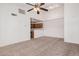 A bright living room with neutral carpet and ceiling fan at 4406 E Carter Dr, Phoenix, AZ 85042