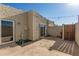 Private backyard featuring a concrete patio, stucco walls, a small garden, and a charming string of lights at 4722 W Via Cynthia --, Glendale, AZ 85301