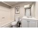 Standard bathroom with tile floors, a tub and shower combo and a framed print at 4722 W Via Cynthia --, Glendale, AZ 85301