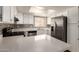 Updated kitchen with stainless steel appliances, tile backsplash, and bright cabinets at 4722 W Via Cynthia --, Glendale, AZ 85301