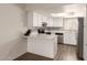Well-lit kitchen with stainless steel appliances, light countertops, and bright cabinetry at 4722 W Via Cynthia --, Glendale, AZ 85301