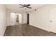 Bright bedroom featuring hardwood flooring and sliding door to a patio at 4722 W Via Cynthia --, Glendale, AZ 85301