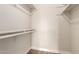 Bright walk-in closet with built in shelves and wood floor at 4722 W Via Cynthia --, Glendale, AZ 85301