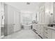 Stylish bathroom boasts marble floors, a standalone tub, and custom vanity at 5051 E Lafayette Blvd, Phoenix, AZ 85018