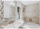 Bright bathroom with soaking tub, elegant vanity, and decorative mirror at 5051 E Lafayette Blvd, Phoenix, AZ 85018