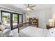 Bedroom with french doors leading to outdoor living area, ceiling fan, and built-in shelves at 5051 E Lafayette Blvd, Phoenix, AZ 85018