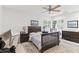 Cozy bedroom featuring a ceiling fan and a well-lit view of the outdoors at 5051 E Lafayette Blvd, Phoenix, AZ 85018