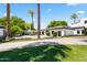 Spacious driveway leading to a well-maintained home with lush landscaping and ample parking at 5051 E Lafayette Blvd, Phoenix, AZ 85018