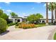 Beautiful home exterior with lush landscaping, mature trees, and a charming entrance, showcasing curb appeal at 5051 E Lafayette Blvd, Phoenix, AZ 85018