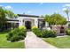 Elegant home exterior with manicured landscaping, a stone walkway, and inviting front entrance at 5051 E Lafayette Blvd, Phoenix, AZ 85018