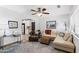 Inviting living room with stylish furniture, a ceiling fan, and a cozy atmosphere for relaxation and entertainment at 5051 E Lafayette Blvd, Phoenix, AZ 85018