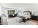 Bright main bedroom suite features a sitting area and large windows with outdoor views at 5051 E Lafayette Blvd, Phoenix, AZ 85018