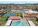 An aerial shot of the community pools and tennis courts at 520 S Greenfield Rd # 7, Mesa, AZ 85206