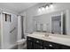 Bathroom featuring a shower/tub combo, framed mirror, and dark vanity at 520 S Greenfield Rd # 7, Mesa, AZ 85206
