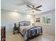 Serene bedroom with tile floors, shutters, neutral walls, and a wrought iron bed frame at 520 S Greenfield Rd # 7, Mesa, AZ 85206