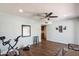 Spacious room with wood flooring, ceiling fan, and contemporary decor at 520 S Greenfield Rd # 7, Mesa, AZ 85206
