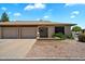 Charming single-story home featuring a two-car garage and a well-maintained, xeriscaped front yard at 520 S Greenfield Rd # 7, Mesa, AZ 85206
