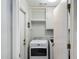 The laundry room features a modern washer and dryer and built-in shelving at 520 S Greenfield Rd # 7, Mesa, AZ 85206