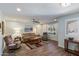 Inviting living room with wood floors, neutral walls, plantation shutters, and comfortable seating at 520 S Greenfield Rd # 7, Mesa, AZ 85206