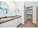 Bathroom with dual sinks and vanities, framed mirrors and tiled countertops at 5733 E Jaeger St, Mesa, AZ 85205