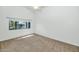 Bright bedroom with large window that lets in plenty of natural light and plush carpeting at 5733 E Jaeger St, Mesa, AZ 85205
