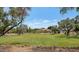Community green space featuring lush green grass and mature shade trees at 5733 E Jaeger St, Mesa, AZ 85205