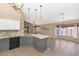 Open kitchen features a large island, granite countertops, pendant lighting, and tiled floors at 5733 E Jaeger St, Mesa, AZ 85205