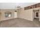 Bright living room with neutral carpet and accent wall at 5733 E Jaeger St, Mesa, AZ 85205