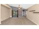 Open concept living room featuring neutral carpet and access to the back patio at 5733 E Jaeger St, Mesa, AZ 85205