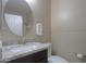Bathroom features a sleek vanity with a granite countertop and modern fixtures at 60 S Agua Fria Ln, Casa Grande, AZ 85194