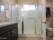 Contemporary bathroom showcasing a glass shower enclosure and vanity with granite countertop at 60 S Agua Fria Ln, Casa Grande, AZ 85194