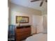 Bedroom featuring a wooden dresser with a mirror, offering storage and style at 60 S Agua Fria Ln, Casa Grande, AZ 85194