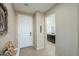 Inviting entryway with tile floors, neutral paint, and access to the kitchen and living areas at 60 S Agua Fria Ln, Casa Grande, AZ 85194