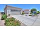 Charming single-story home with desert landscaping, and a two-car garage at 60 S Agua Fria Ln, Casa Grande, AZ 85194