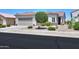 Charming single-story home with tile roof, desert landscaping, and a two-car garage at 60 S Agua Fria Ln, Casa Grande, AZ 85194