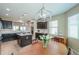 Bright kitchen with island, dark cabinets and dining area, perfect for entertaining at 60 S Agua Fria Ln, Casa Grande, AZ 85194