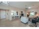 Comfortable living room with tile flooring, ample seating, and convenient breakfast bar at 60 S Agua Fria Ln, Casa Grande, AZ 85194