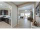 Spacious living room with modern design, tile floors, and an open floor plan at 60 S Agua Fria Ln, Casa Grande, AZ 85194